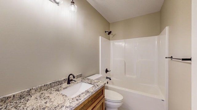 full bathroom featuring toilet, vanity, and  shower combination