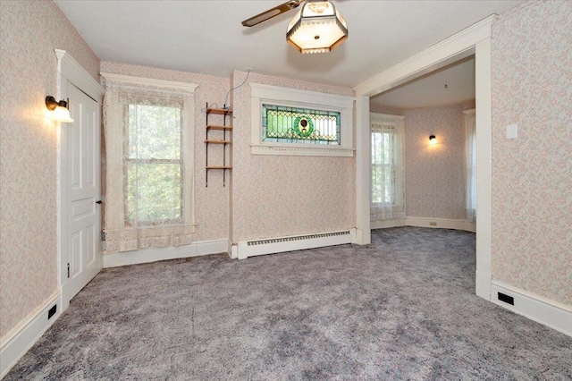 interior space featuring a baseboard radiator and ceiling fan