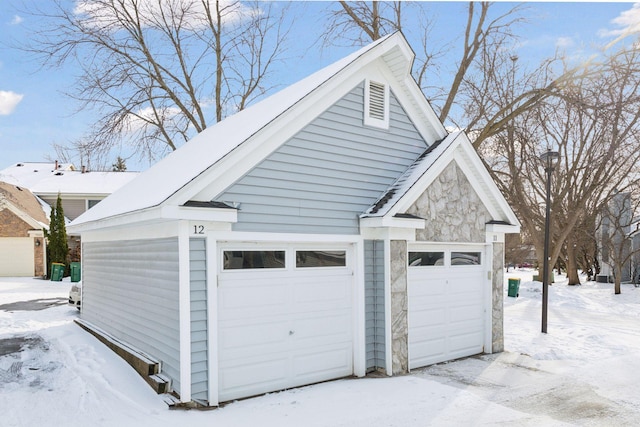 view of snow covered garage