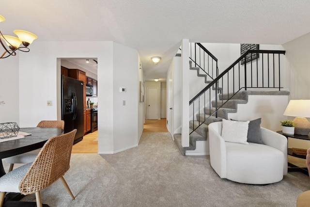 interior space featuring an inviting chandelier and a textured ceiling