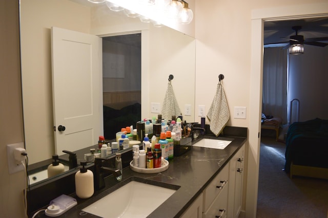 bathroom featuring ceiling fan and vanity