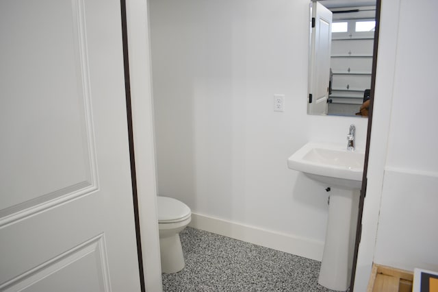 bathroom featuring toilet