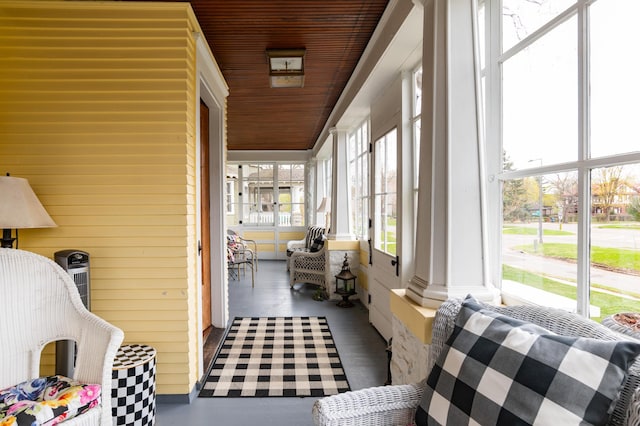 sunroom featuring wooden ceiling