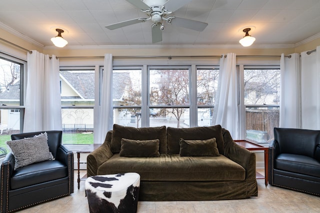 living room with ceiling fan, baseboard heating, and ornamental molding