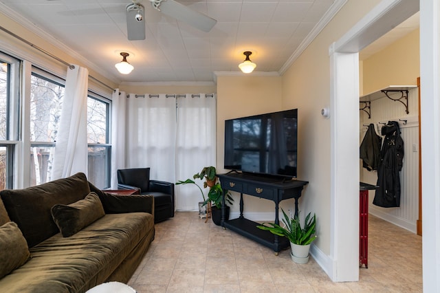 living room featuring ornamental molding and light tile patterned flooring