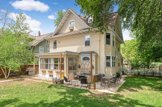 back of house featuring a patio area, a yard, and cooling unit