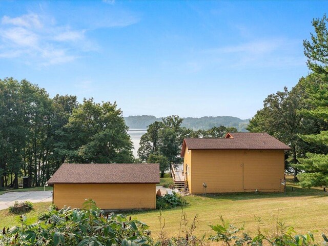 exterior space featuring a mountain view and a yard