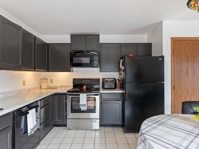 kitchen with a textured ceiling, light tile patterned flooring, and black appliances