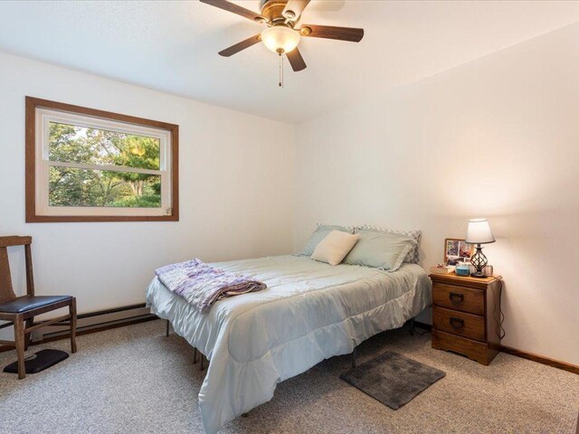 bedroom featuring ceiling fan and carpet flooring