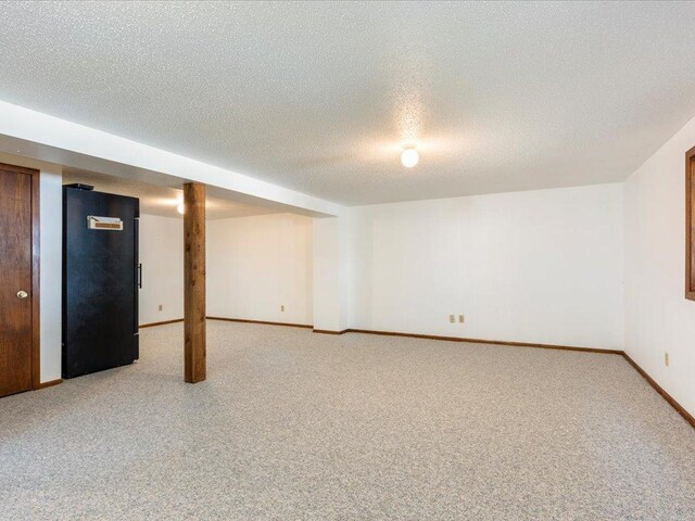 basement with a textured ceiling