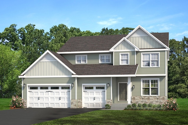 craftsman house featuring a garage and a front lawn