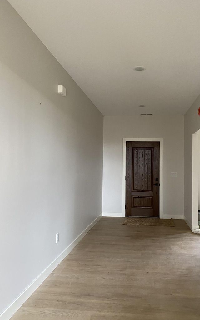 empty room with light hardwood / wood-style floors