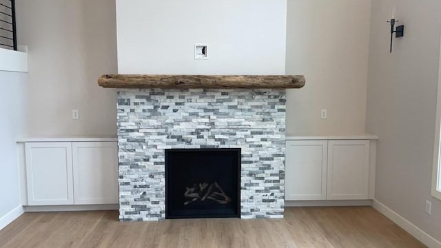 room details featuring hardwood / wood-style floors and a fireplace