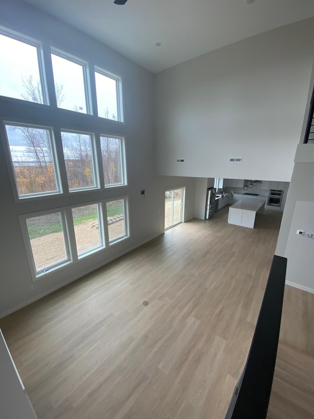 unfurnished living room with light wood-type flooring