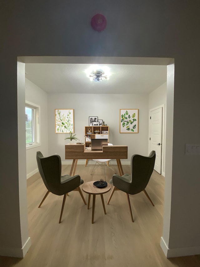 office space with light wood-type flooring