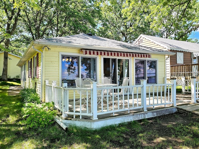 bungalow-style home with a deck