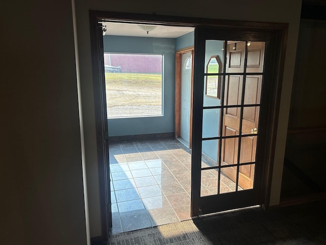 entryway with tile patterned floors