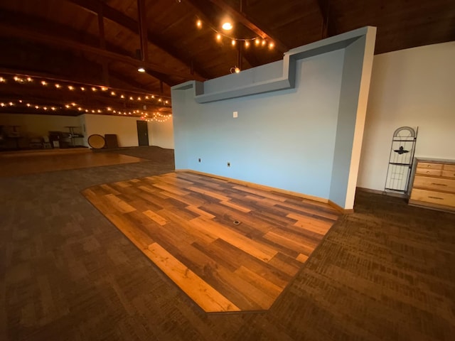 basement with dark wood-type flooring and wooden ceiling