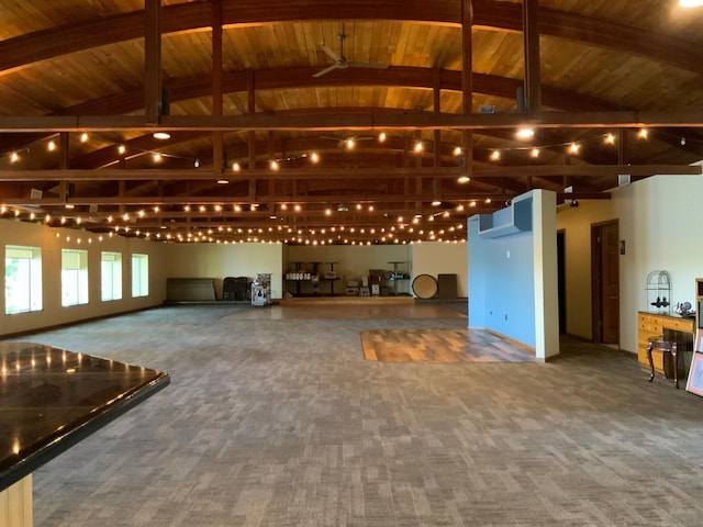 miscellaneous room featuring carpet flooring, high vaulted ceiling, and rail lighting