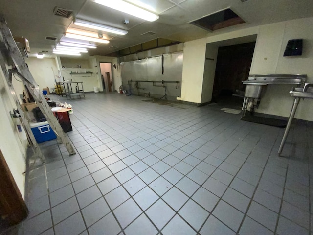 basement featuring tile patterned flooring