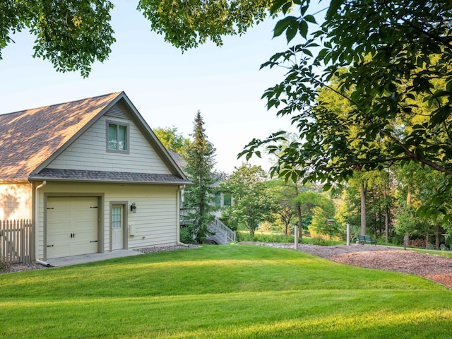 rear view of property featuring a lawn