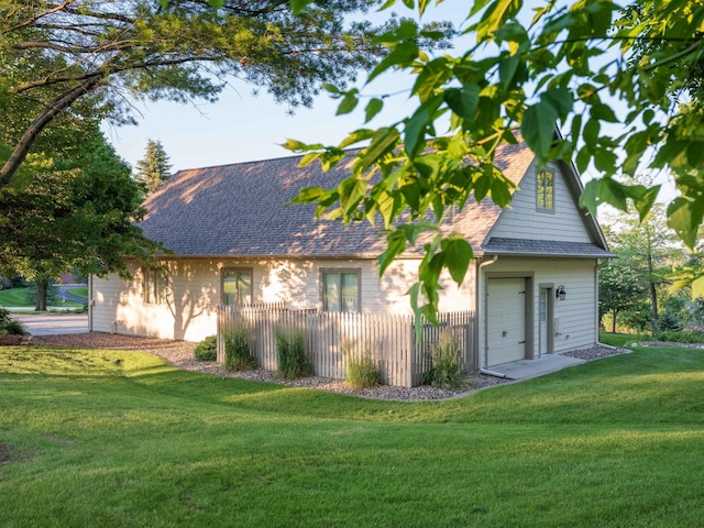 rear view of house featuring a lawn