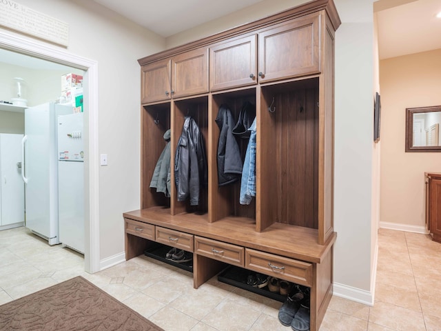 mudroom with light tile patterned flooring