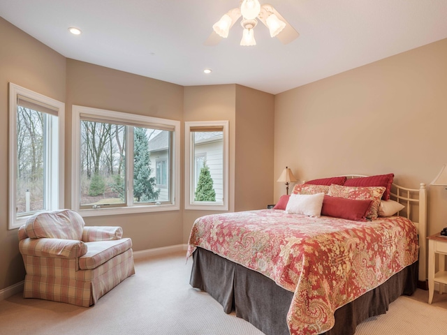 carpeted bedroom featuring ceiling fan