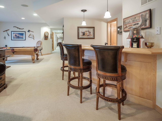 bar with light carpet, pendant lighting, and billiards