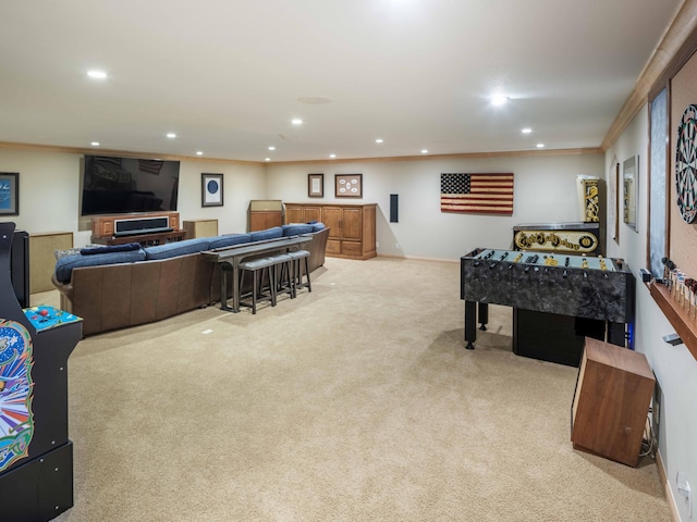 game room with crown molding and light colored carpet