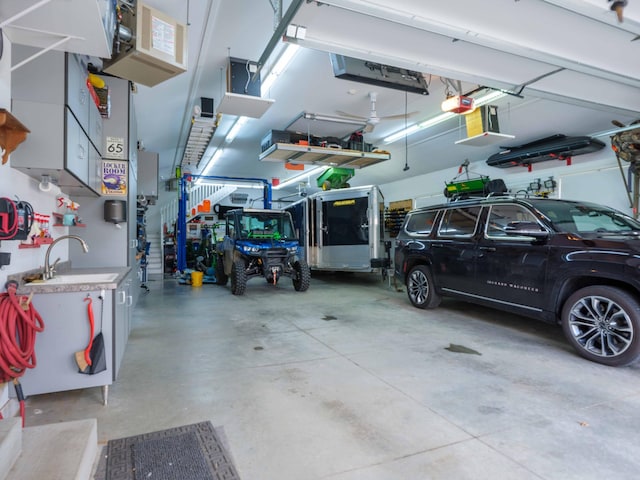 garage featuring sink and a garage door opener