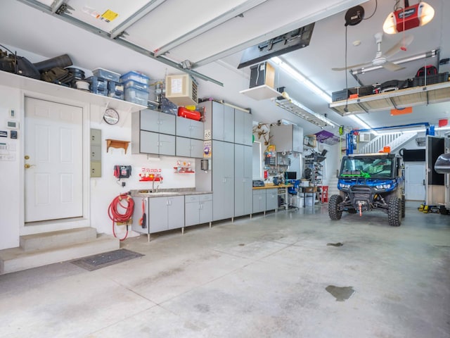 garage with sink and a garage door opener