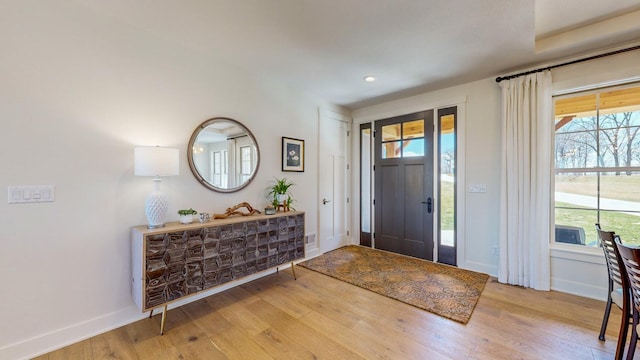 entryway with light hardwood / wood-style floors