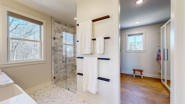 bathroom featuring tiled shower and hardwood / wood-style floors