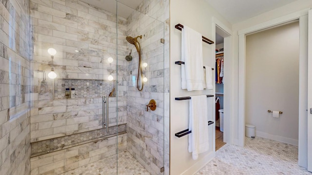 bathroom featuring tile patterned floors and an enclosed shower