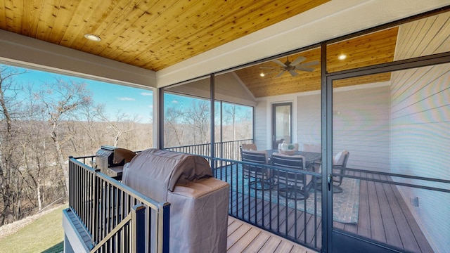 wooden terrace featuring ceiling fan