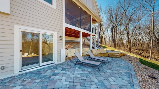 view of patio / terrace with a sunroom