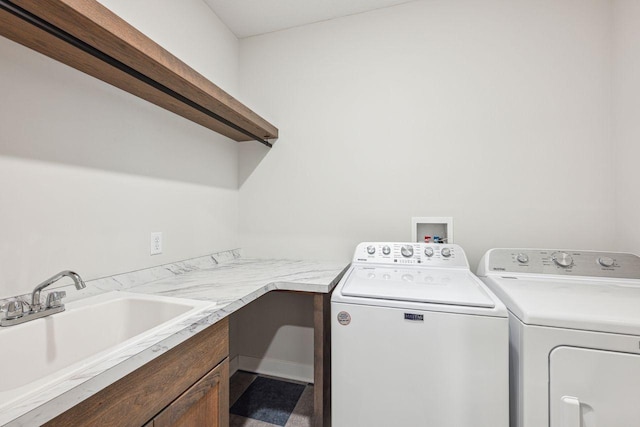 laundry room featuring sink and washing machine and clothes dryer