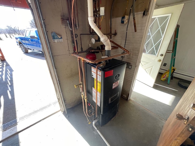 utility room with a baseboard heating unit