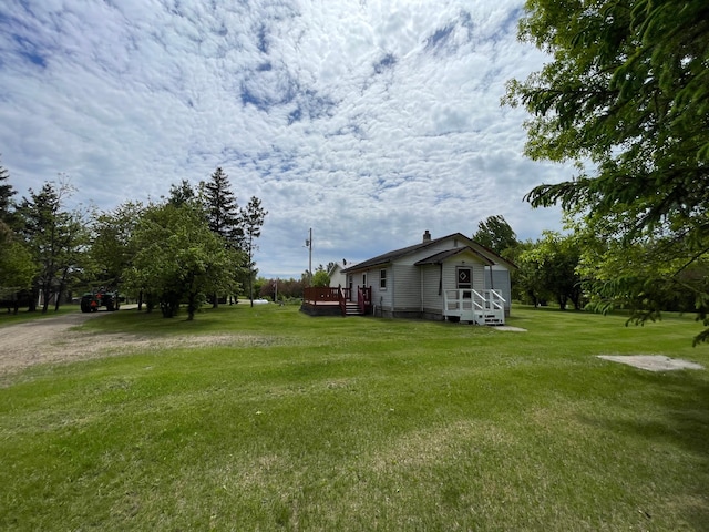 view of yard featuring a deck