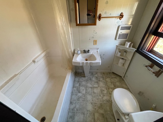 bathroom featuring sink and toilet