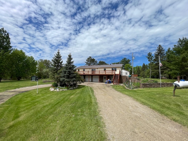 view of front facade featuring a front lawn and a deck