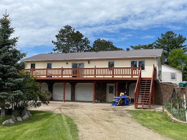 view of front of property featuring a garage and a wooden deck