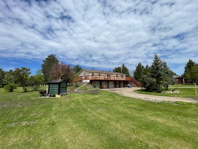 view of yard featuring a wooden deck