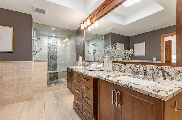 bathroom with vanity and an enclosed shower