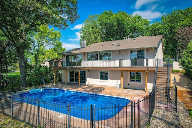 view of swimming pool with a deck and a patio area