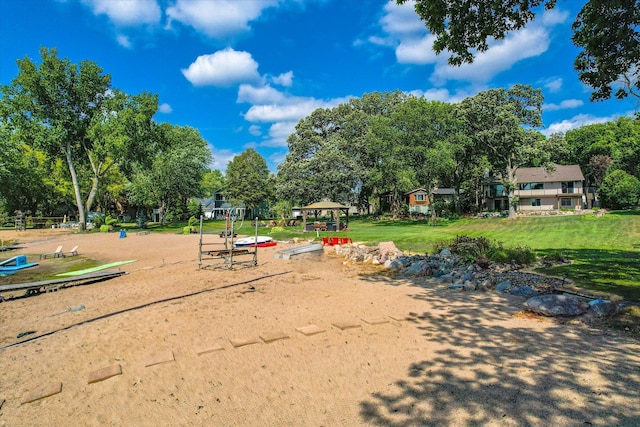 view of community featuring a yard and a gazebo