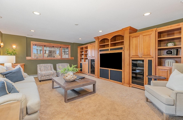 living room with a baseboard heating unit and light colored carpet