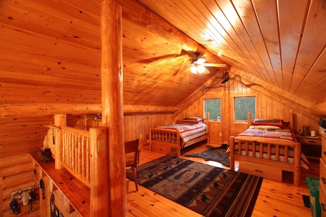 bedroom with vaulted ceiling, light hardwood / wood-style flooring, and wood ceiling