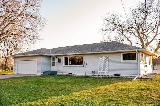 single story home with a garage and a front lawn